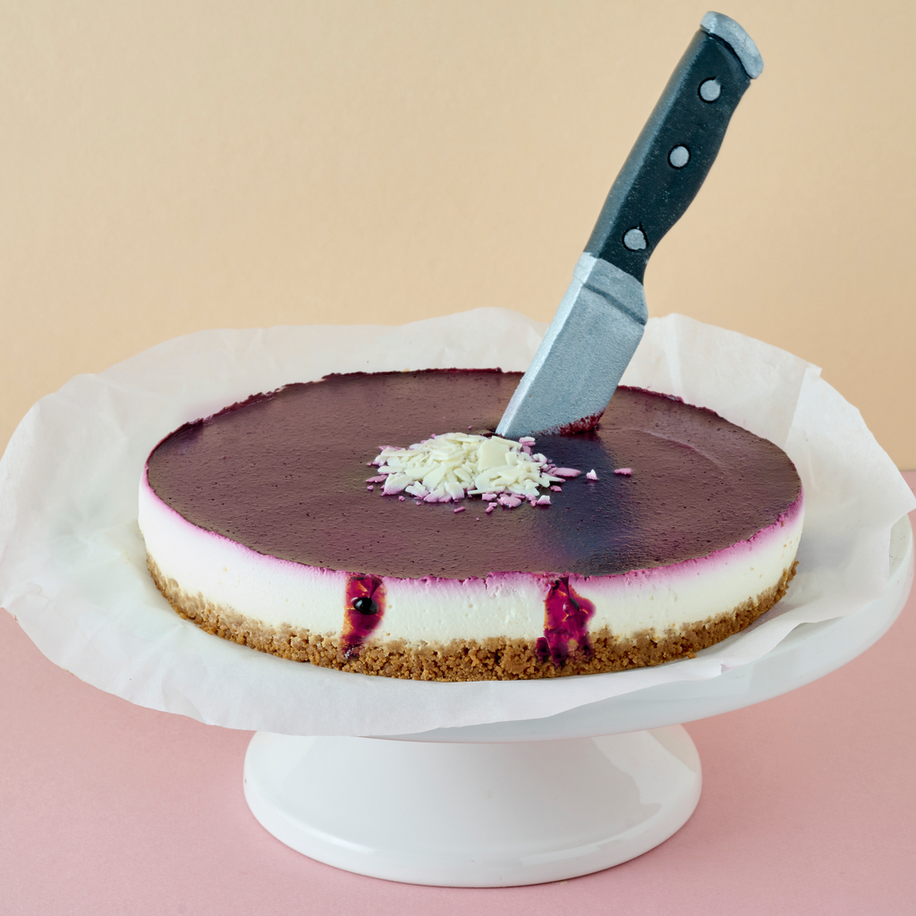 Halloween cheesecake with marzipan knife